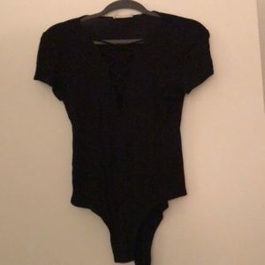 Black body suit, criss cross chest detail